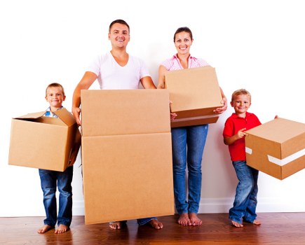 Moving van and removal team preparing a home move in Hook
