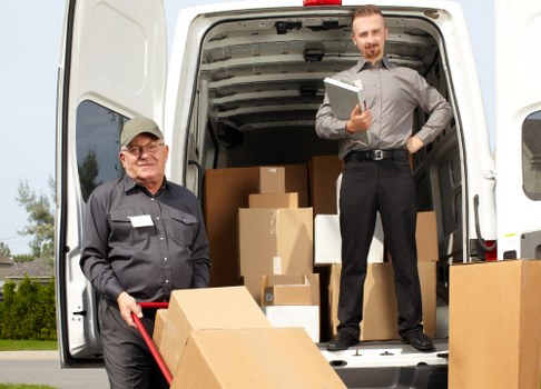 Packed boxes and furniture ready for a local removal service in Hook