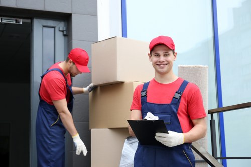 Moving team using protective equipment during a Hook removal service