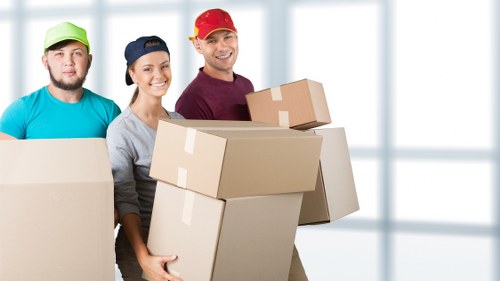 Careful wrapping of fragile household items during packing services in Hook