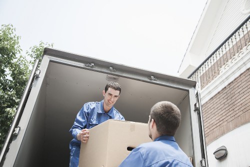 A local removals van serving residential streets in Hook